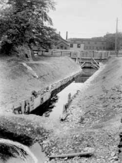 Revamped mill race, east branch of the Charles River, to the south of the Worcester Turnpike (Route 9), looking north, c. 1888. 